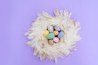 Easter scene with colored eggs in nest