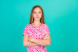© deagreez - Photo portrait of lovely teen lady crossed hands confident dressed stylish pink print garment isolated on aquamarine color background