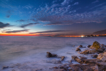 Canvas Print - Long exposure photo of sunset on a rocky beach - Alanya, Turkey