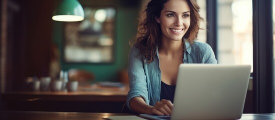 Wall Mural - Focused Female Working on Laptop at Modern Desk in Home Office Environment