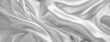 white gray satin texture that is white silver fabric silk background with beautiful soft blur