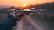 Hand Launching Drone at Sunset Technology and Innovation in Aerial