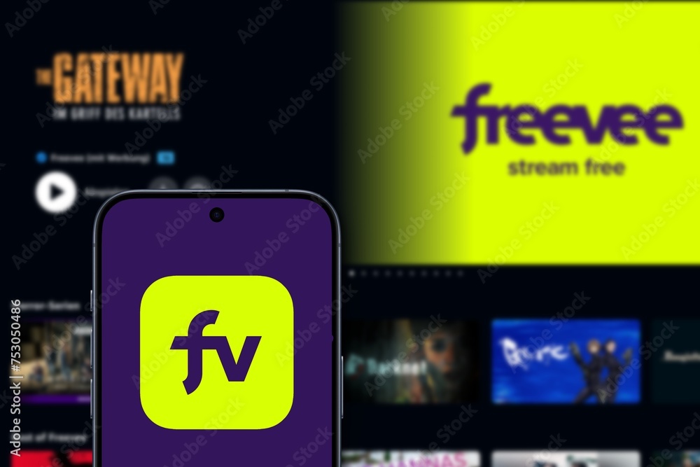 freevee logo is displayed on a modern smartphone in the background the ...