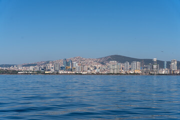 Wall Mural - A city skyline is reflected in the water