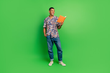 Poster - Full length portrait of clever cheerful person hold read opened book empty space isolated on green color background