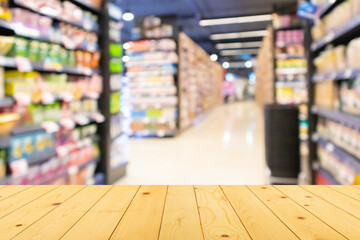 Sticker - Empty wood table top with supermarket blurred background for product display