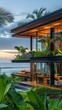 Modern tropical architecture with a sea view, embraced by lush greenery.