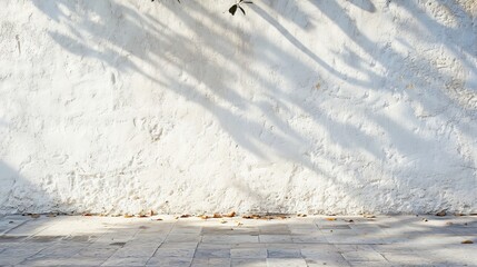 Poster - As the sun casts a shadow over the white concrete wall, the shadow is shaped by the sun.