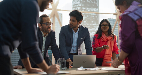 Aufkleber - Finance Department Having a Meeting to Discuss a Project with Board Members. South Asian Colleague Using Laptop Computer, Working in Modern Office, Employees Having a Conversation in a Conference Room