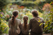 © bajita111122 - A father sits with his daughters in a lush garden, enjoying the serene beauty of nature and each other's company at dusk..