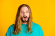 Photo of impressed young man open mouth staring cant believe empty space isolated on yellow color background