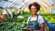 Smiling African-American Woman Analyzing Greenhouse Crops with Digital Tablet