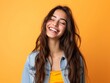 © Cheetose - Teen fashion woman smiling on yellow background.