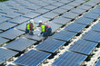 © ultramansk - Photovoltaic engineers work on floating photovoltaics. workers Inspect and repair the solar panel equipment floating on water. Engineer working setup Floating solar panels Platform system on the lake.
