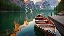Lake braies in south tyrol, italy at sunrise, Beautiful view of traditional wooden rowing boat on scenic Lago di Braies in the Dolomites in scenic morning light at sunrise, AI Generated