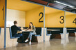© Jacob Lund - Tech work in coworking office: Business professionals engaged in software development and coding