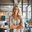 © dianacrimea - Female business owner stands proudly, delighted by her company's growth fueled by strong internet-company. Dressed in semi-casual attire, she exudes confidence against the backdrop of a vibrant, moder