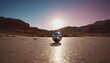 Metal round ball with a mirror reflection, against the backdrop of the desert and mountains at sunset, out of focus, futuristic design, extraterrestrial technology, minimalism