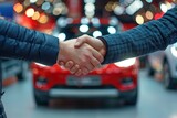 Fototapeta  - Good deal handshake close up on blurred background of new car for sale in a showroom