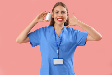 Canvas Print - Female doctor with pill bottle showing 