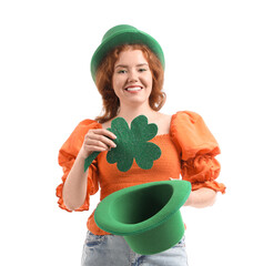 Young redhead woman with Leprechaun's hat and paper clover on white background. St. Patrick's Day celebration