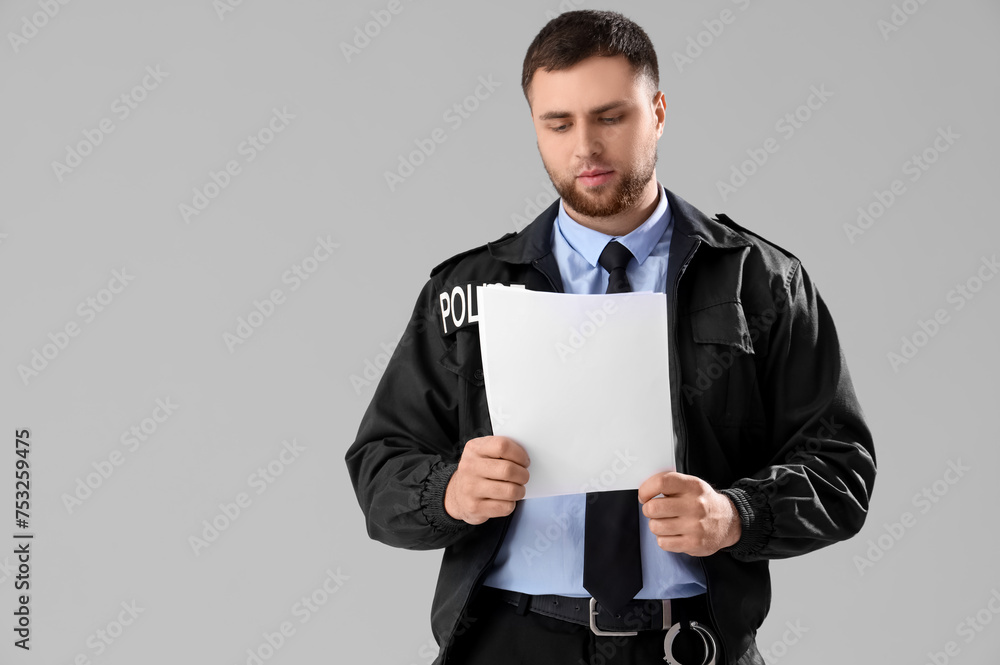 Police Document Background Male police officer with documents on grey background Stock Photo ...