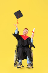 Sticker - Male graduate in wheelchair with diploma throwing hat on yellow background