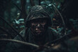 © MVProductions - A dirty soldier in the forest, a dark photo of war and soldiers. Concept of warfare