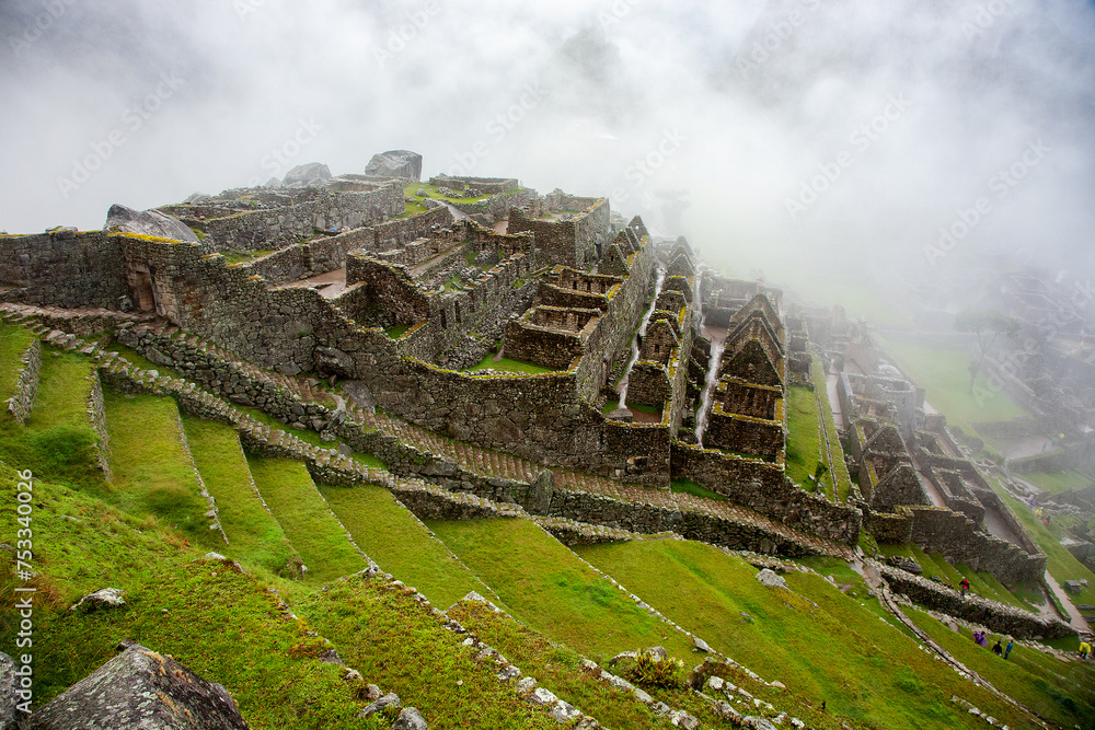 Machu Picchu is an iconic archaeological site located in the Andes Mountains of Peru. It is one of the most famous and visited tourist destinations in the world.