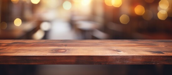 Sticker - Wooden table with blurred abstract background for product display in restaurant or cafe