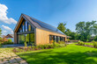 © MVProductions - New modern eco friendly passive house with a photovoltaic system on the roof and landscaped yard