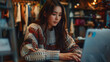 Youthful Asian woman poised before a laptop, fully immersed in her role as a designer and stylist