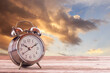 © nilawan - Retro clock vintage color tone in the garden with morning sunlight