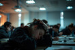 Exhausted student resting her head on her hand while attending class, representing sleep deprivation and academic pressure in college and university