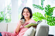 © StockImageFactory - Pretty Indian young girl reading book or novel at home