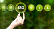 Hand of human holding green earth ESG icon for Environment Social and Governance, World sustainable environment concept.