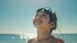 © Rudsaphon - Happy Latin Girl with Swimming Goggles on Beach, To convey a sense of joy, fun, and relaxation associated with summertime and beach vacations,