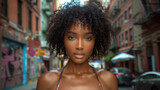 Fototapeta Uliczki - Beautiful curly Black Young Woman at the street