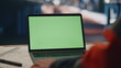 © stockbusters - Green screen laptop factory specialist table close up. Unknown engineer looking