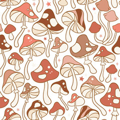 Seamless vector pattern with hand drawn groovy vintage and mushrooms and stars. Perfect for textile, wallpaper or print design.