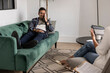 © PintoArt - Man Expressing Discomfort on Couch During Therapy Session