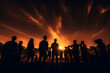 © Lazy_Bear - Group of people standing together, silhouetted against the setting sun in the horizon. People have fun at night party