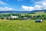 Fototapeta  - 
Rural summer landscape. Village Smerekowiec on a sunny summer day, Low Beskids (Beskid Niski), Poland