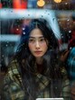 © jiawei - Woman Looking Out Window With Rain Falling