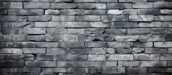 Canvas Print - Sturdy Black Stone Wall Standing Against a Clean White Background