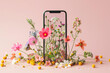 
transparent smartphone with growing spring flowers isolated on pastel background. creative digital detox concept
