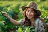 Fototapeta Pokój dzieciecy - woman in a cute gardening outfit smiling while tending to gardening 
