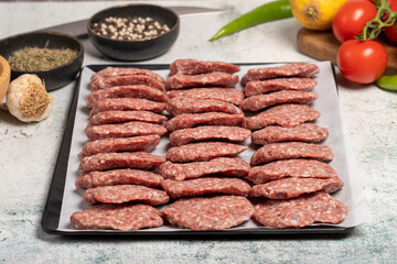 Wall Mural - Beef meatballs. Butcher products. Raw beef meatballs on stone background