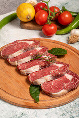 Wall Mural - Beef entrecôte or ribeye. Butcher products. Raw beef ribeye on stone background