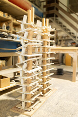 Wall Mural - man working in a carpentry shop. Photographs of the work and backgrounds for publications with copy space.